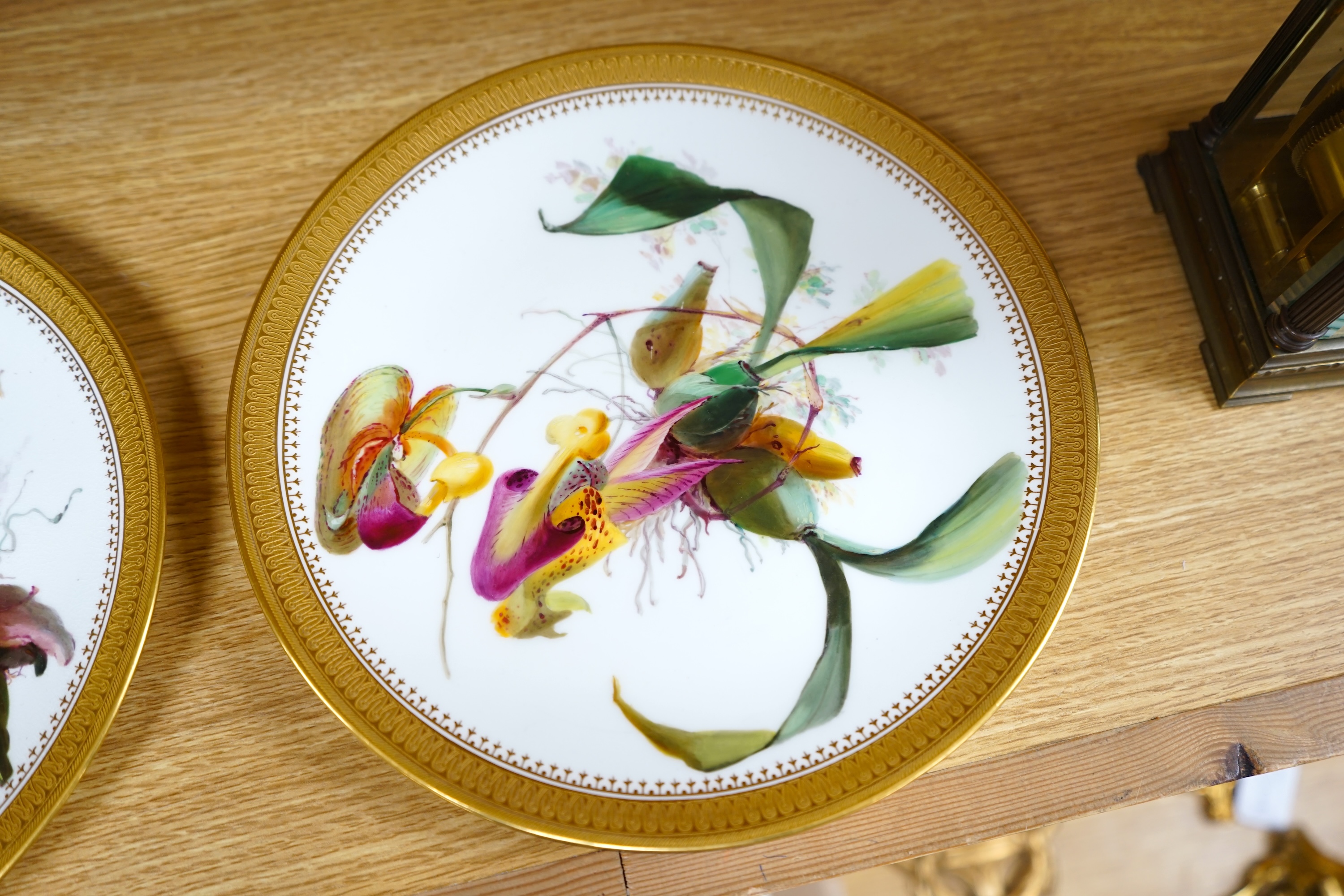 A pair of 19th century Mintons bone china plates, hand painted with flowers, 24cm in diameter. Condition - good